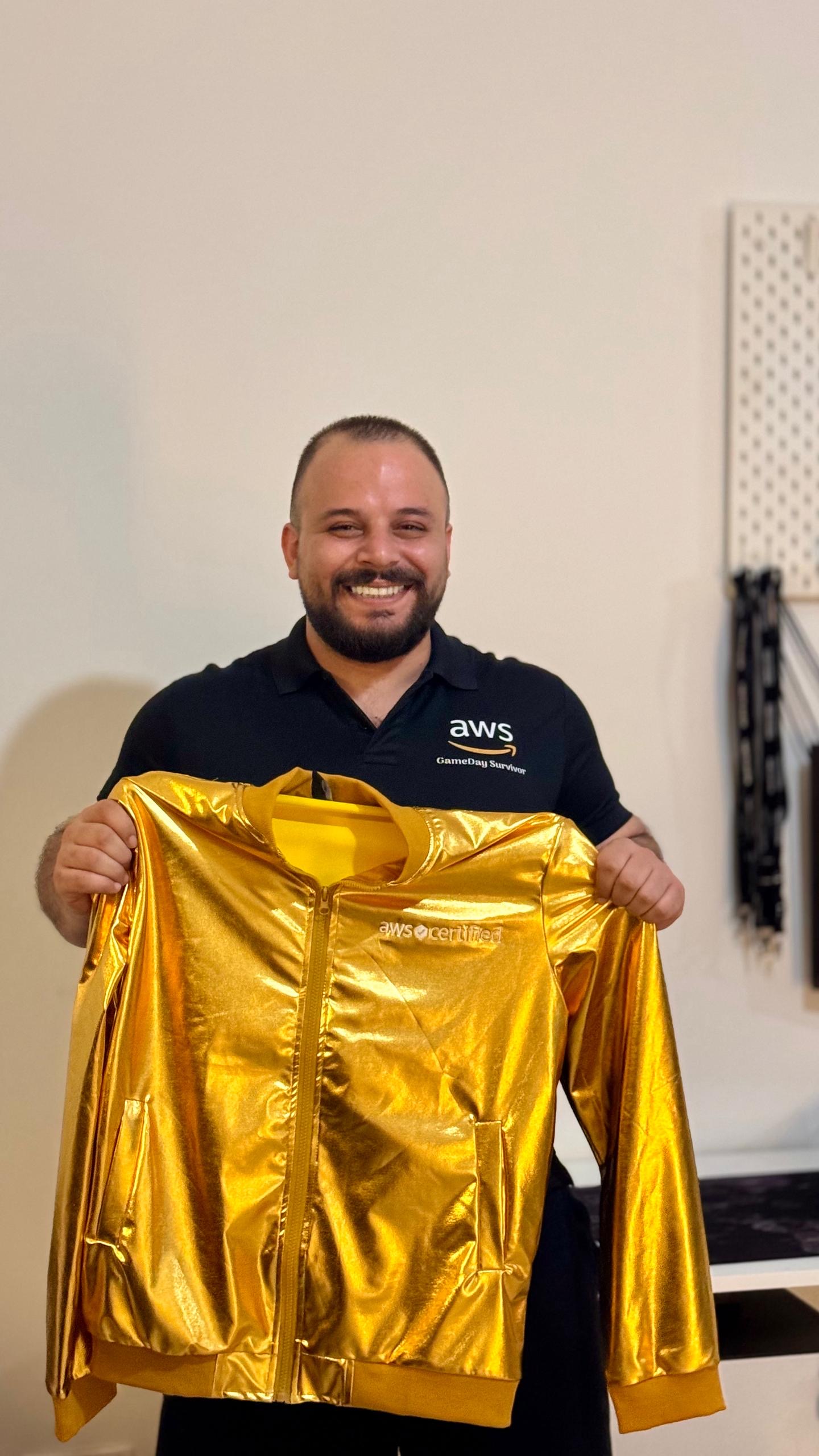 Johnny Suleiman holding the AWS Golden Jacket